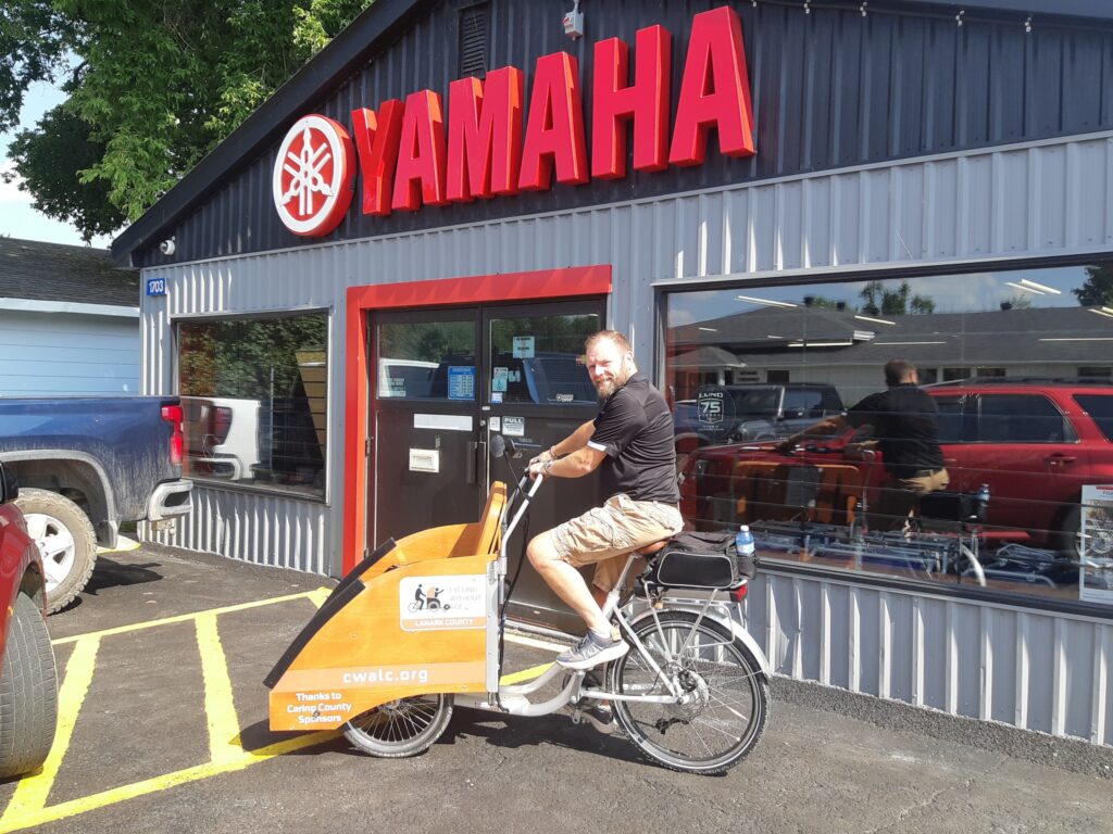 Photo of Blake Burgess of CP Marine riding a Trishaw.