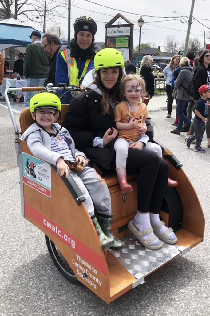 River, Erica and their mother Nova Lackey taking a ride in a Trishaw with Pilot Treff Peters