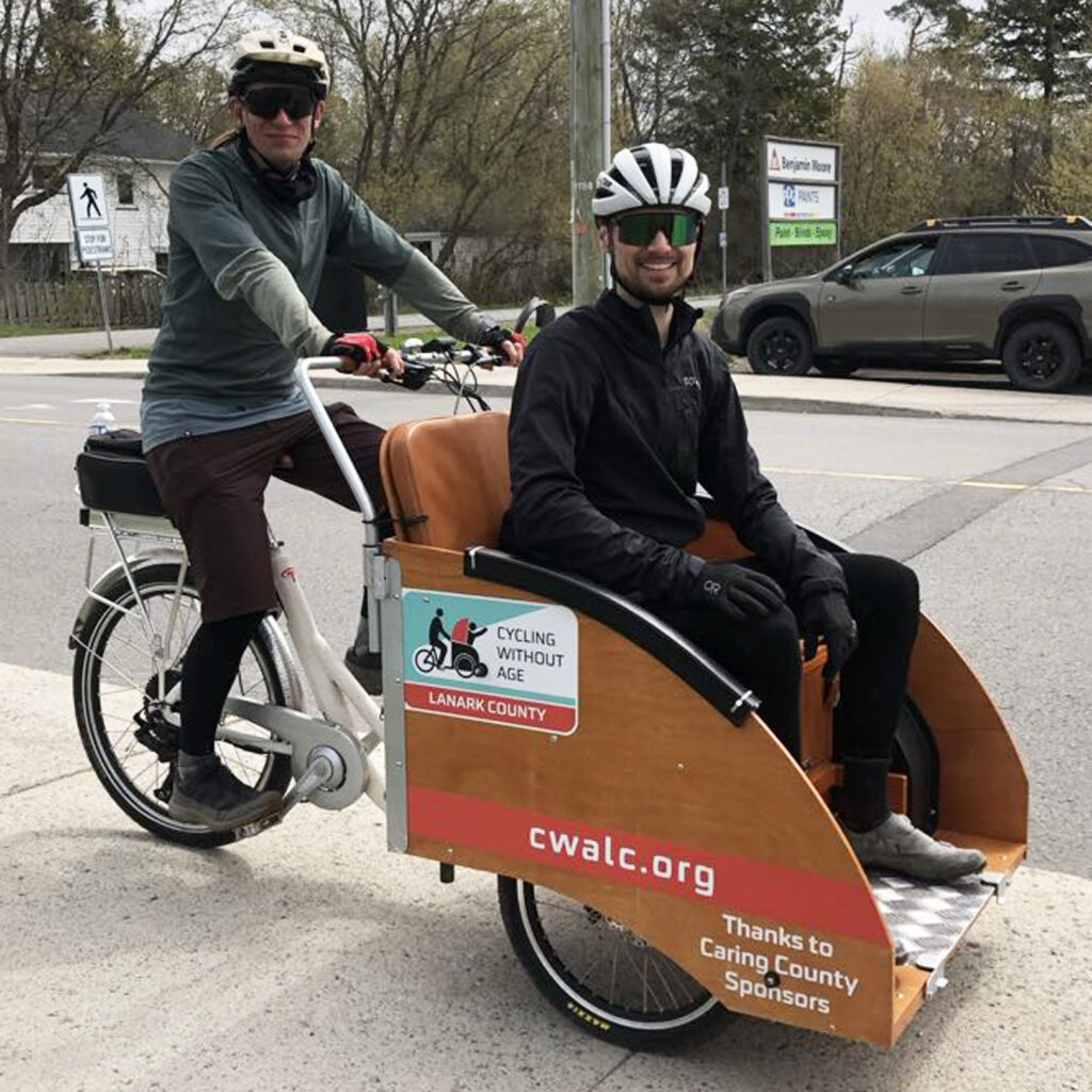Potential pilots Will Grierson and Benoit Vanus give the Trishaw a try.